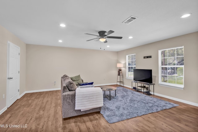 101 30th St, Gulfport, MS 39507 - living room featuring wood finished floors, baseboards, ceiling fan, and recessed lighting