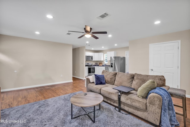 101 30th St, Gulfport, MS 39507 - living area with light wood-style floors, a ceiling fan, recessed lighting, and baseboards