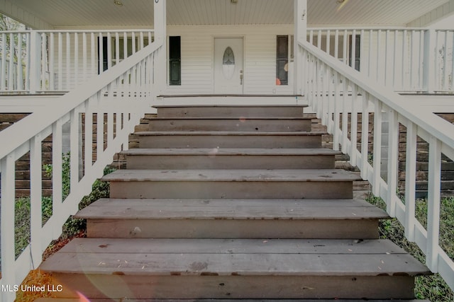 doorway to property featuring covered porch