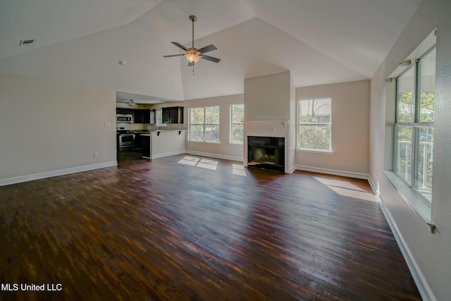 unfurnished living room featuring baseboards, visible vents, ceiling fan, dark wood-style flooring, and a fireplace