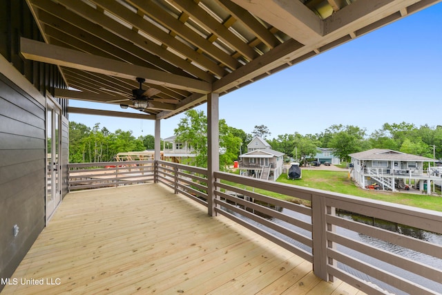 wooden terrace featuring ceiling fan