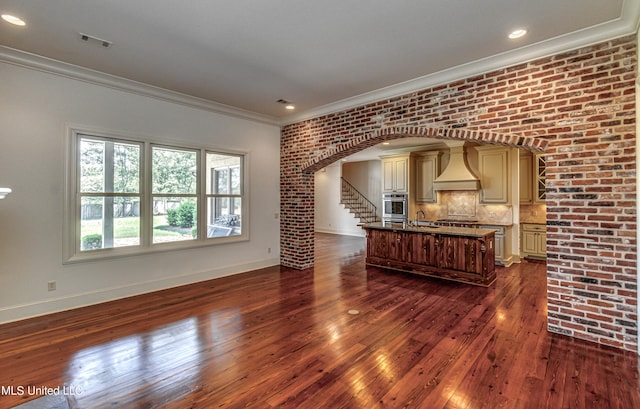 2024 E Northside Dr, Jackson, MS 39211 - interior space with a sink, dark wood finished floors, baseboards, visible vents, and ornamental molding