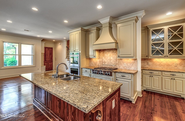 2024 E Northside Dr, Jackson, MS 39211 - kitchen featuring custom exhaust hood, a sink, stainless steel appliances, cream cabinetry, and light stone countertops