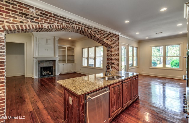 2024 E Northside Dr, Jackson, MS 39211 - kitchen featuring stainless steel dishwasher, a sink, open floor plan, baseboards, and ornamental molding