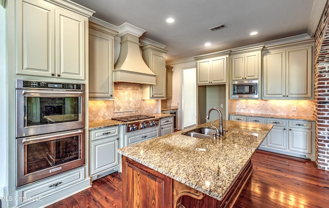 2024 E Northside Dr, Jackson, MS 39211 - kitchen featuring custom exhaust hood, cream cabinetry, appliances with stainless steel finishes, and a sink