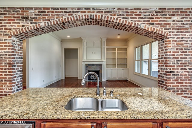 2024 E Northside Dr, Jackson, MS 39211 - kitchen featuring wood finished floors, baseboards, ornamental molding, and a sink