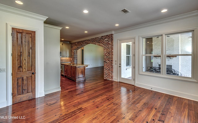 2024 E Northside Dr, Jackson, MS 39211 - spare room featuring recessed lighting, visible vents, ornamental molding, arched walkways, and dark wood-type flooring