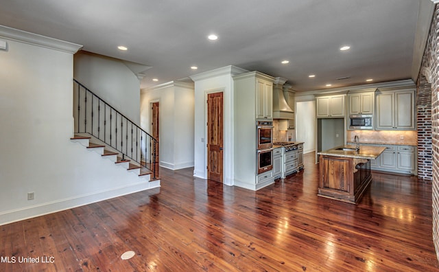 2024 E Northside Dr, Jackson, MS 39211 - kitchen with crown molding, custom exhaust hood, stainless steel appliances, and dark wood-style floors