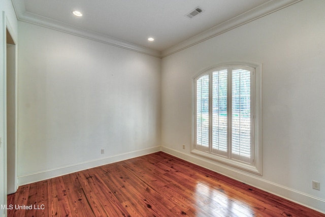 2024 E Northside Dr, Jackson, MS 39211 - spare room with baseboards, wood finished floors, visible vents, and crown molding
