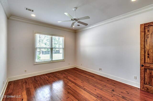2024 E Northside Dr, Jackson, MS 39211 - unfurnished room featuring baseboards, visible vents, a ceiling fan, dark wood-type flooring, and ornamental molding