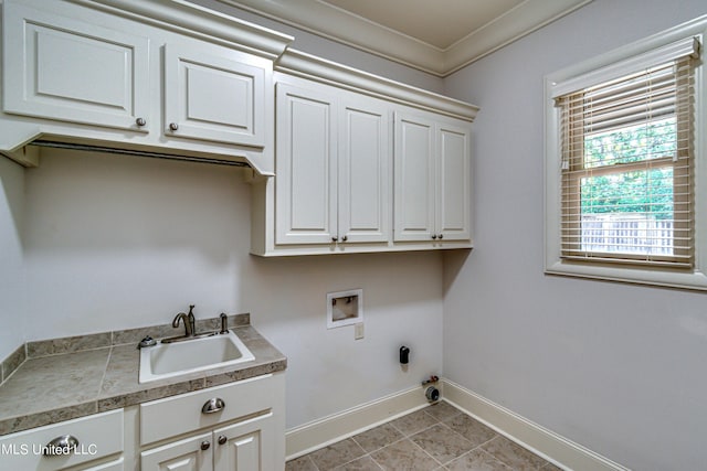 2024 E Northside Dr, Jackson, MS 39211 - washroom with a sink, baseboards, washer hookup, hookup for a gas dryer, and cabinet space
