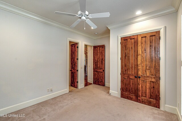 2024 E Northside Dr, Jackson, MS 39211 - unfurnished bedroom with carpet, a closet, baseboards, and ornamental molding