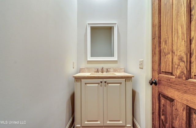 2024 E Northside Dr, Jackson, MS 39211 - bathroom with baseboards and vanity