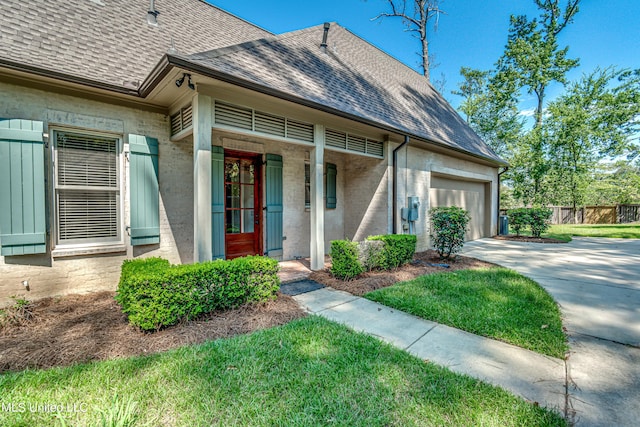 2024 E Northside Dr, Jackson, MS 39211 - view of front of home featuring an attached garage, roof with shingles, fence, and driveway