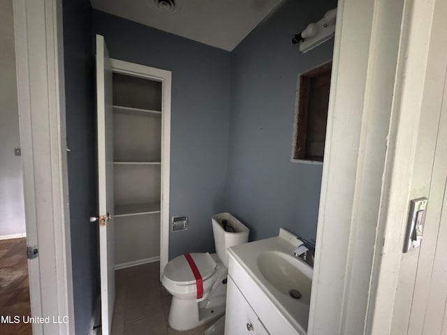 3327 Casa Grande Cir, Jackson, MS 39209 - half bath with tile patterned floors, vanity, and toilet