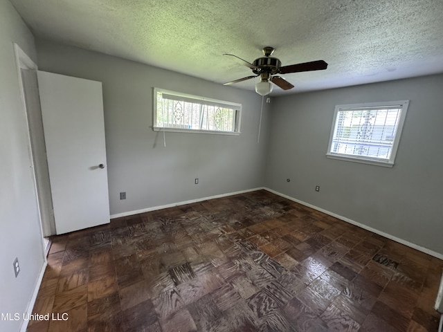 3327 Casa Grande Cir, Jackson, MS 39209 - spare room featuring ceiling fan, baseboards, and a textured ceiling