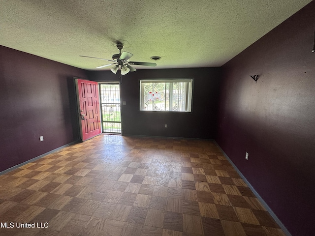 3327 Casa Grande Cir, Jackson, MS 39209 - spare room featuring a ceiling fan, a textured ceiling, and baseboards