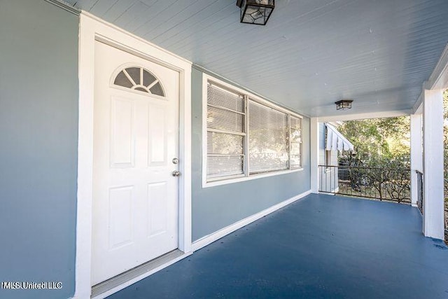 doorway to property featuring covered porch