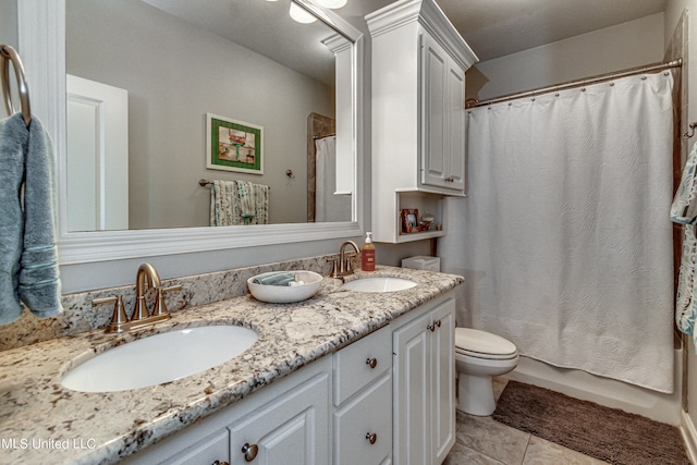 bathroom featuring vanity, curtained shower, toilet, and tile patterned floors