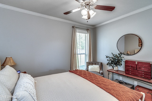 bedroom with ornamental molding, wood-type flooring, and ceiling fan