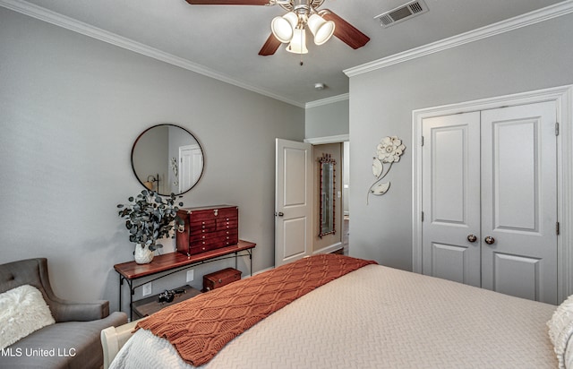 bedroom with a closet, ornamental molding, and ceiling fan