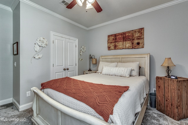 carpeted bedroom with crown molding, a closet, and ceiling fan