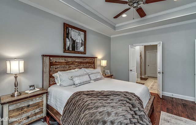 bedroom featuring crown molding, ceiling fan, and dark hardwood / wood-style flooring