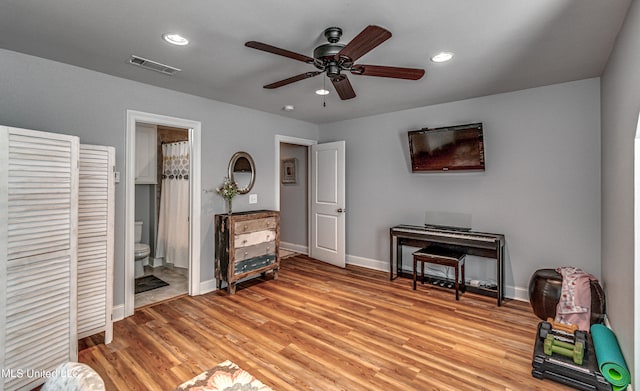 misc room featuring light wood-type flooring and ceiling fan