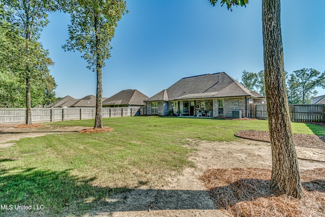 view of yard with central AC