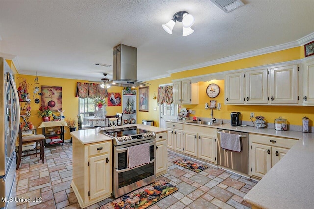kitchen with light countertops, stainless steel appliances, island range hood, and a sink