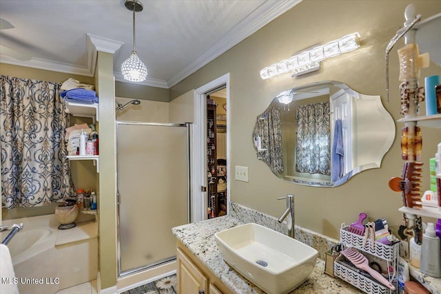 full bath with vanity, ornamental molding, a bath, and a stall shower