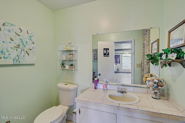 bathroom with toilet and vanity