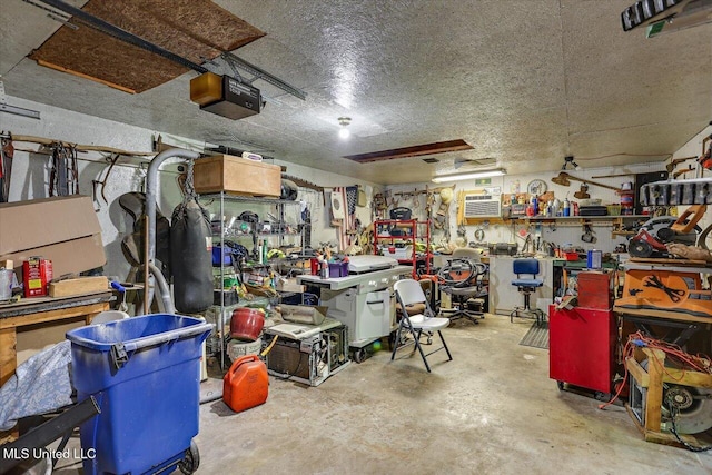 garage with a workshop area and a garage door opener