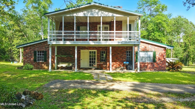 18 Shamrock Ln, Carriere, MS 39426 - back of house featuring brick siding and a yard
