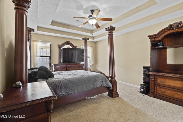 4239 Three Wishes Cv, Olive Branch, MS 38654 - bedroom with a ceiling fan, a tray ceiling, carpet, visible vents, and decorative columns