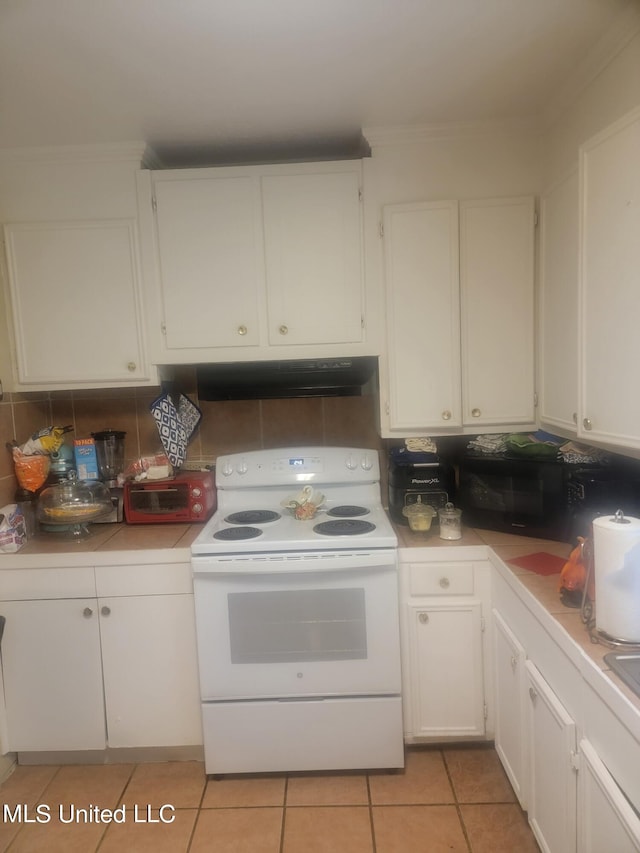 kitchen with white cabinets, light tile patterned floors, extractor fan, white electric range oven, and crown molding