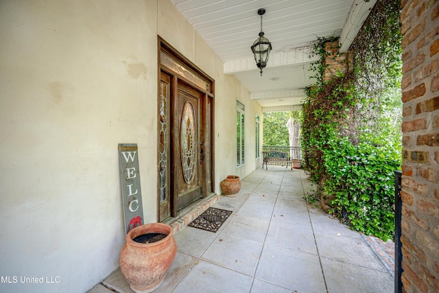 doorway to property with a porch