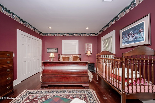 bedroom with wood finished floors, recessed lighting, and visible vents