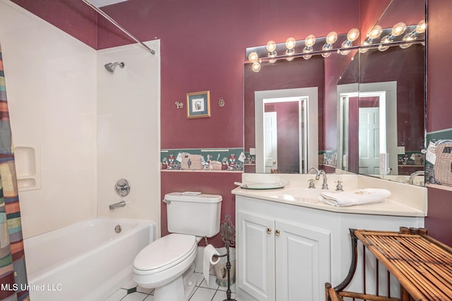 full bathroom with tile patterned floors, shower / bath combo with shower curtain, toilet, and vanity