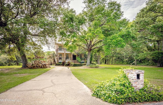 exterior space featuring a porch and a front yard