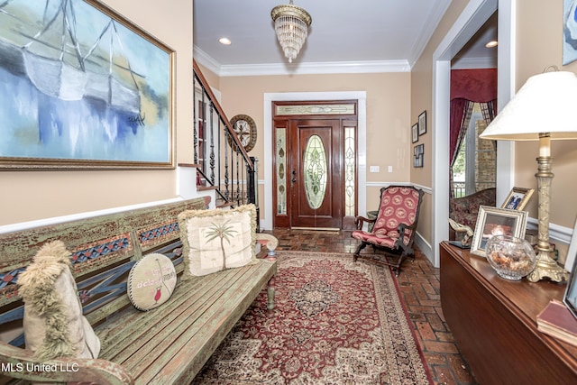 entrance foyer featuring stairway, ornamental molding, brick floor, and plenty of natural light