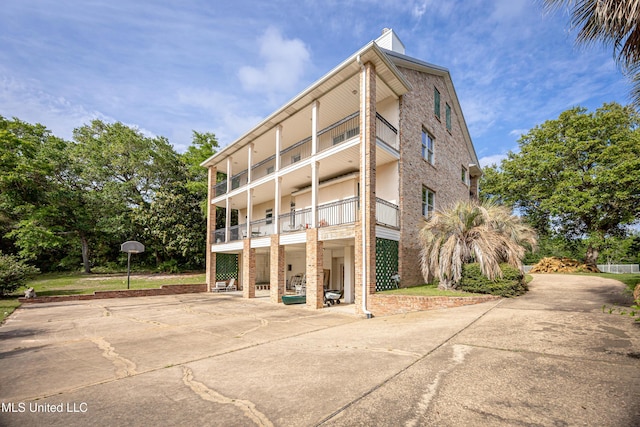 view of building exterior with driveway