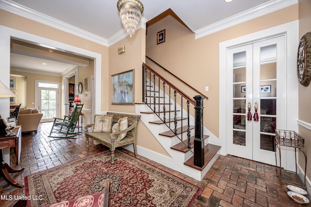 interior space featuring crown molding, brick floor, french doors, and baseboards