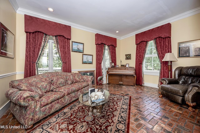 living area with crown molding, baseboards, brick floor, and recessed lighting