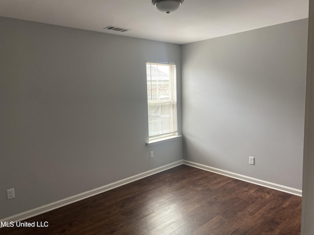 9078 Mallard Park Blvd, Walls, MS 38680 - spare room featuring dark wood finished floors and baseboards