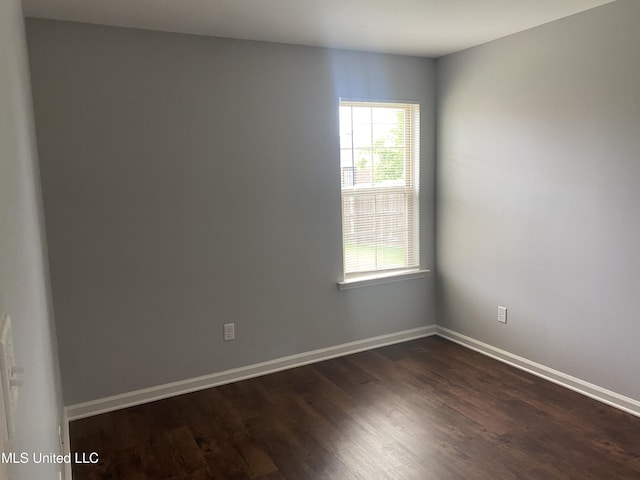 9078 Mallard Park Blvd, Walls, MS 38680 - empty room with dark wood-style flooring and baseboards