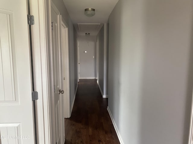 9078 Mallard Park Blvd, Walls, MS 38680 - hall with attic access, dark wood-style flooring, and baseboards