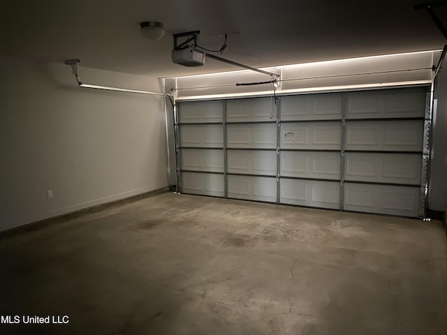 9078 Mallard Park Blvd, Walls, MS 38680 - garage with baseboards and a garage door opener