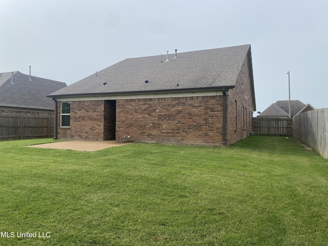 9078 Mallard Park Blvd, Walls, MS 38680 - back of house featuring brick siding, a patio area, and a shingled roof