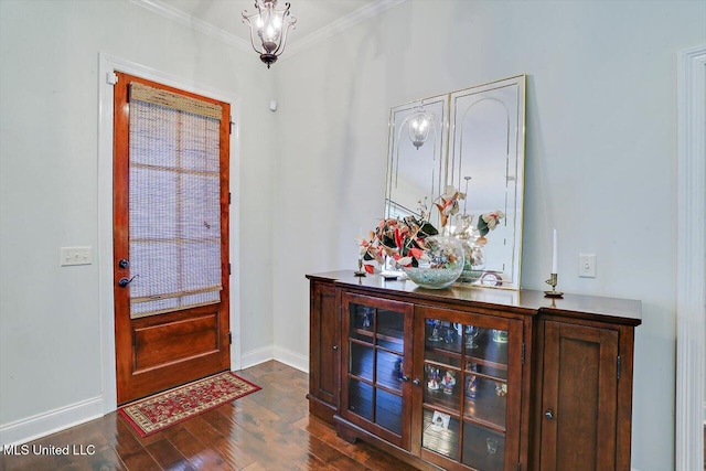 foyer entrance featuring dark hardwood / wood-style floors and crown molding